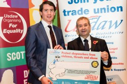 Mark Stands With Shop Workers