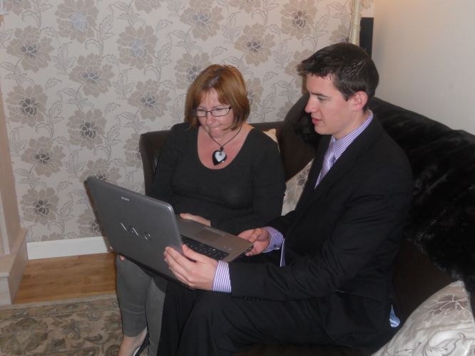 Mark examines Broadband problems in Craigmarloch with constituent Maria Murray