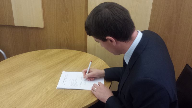 Mark signs his British Sign Language (BSL) (Scotland) Bill